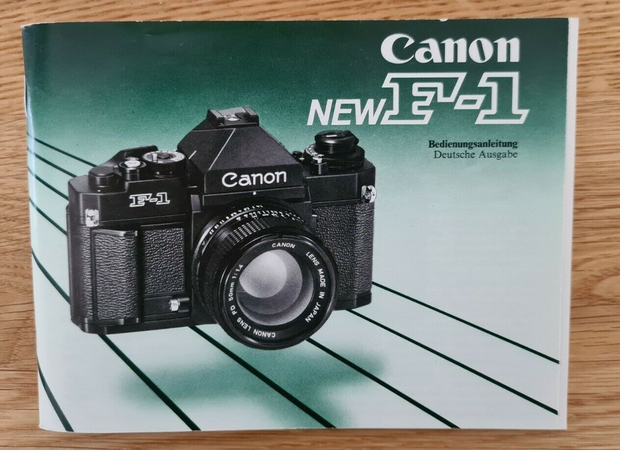 Canon NEW F-1 mit 50 mm 11.4 FD Objektiv, AE Motor Drive und Blitzgerät 155A