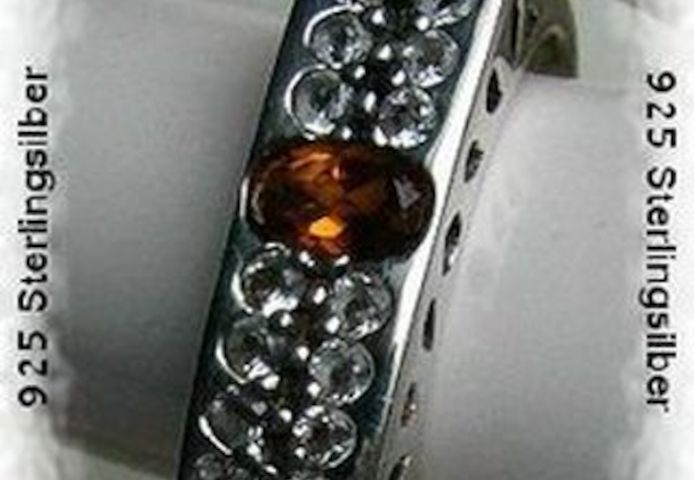 Ring, 925 Silber mit gefassten Weistopasen und einen Citrin